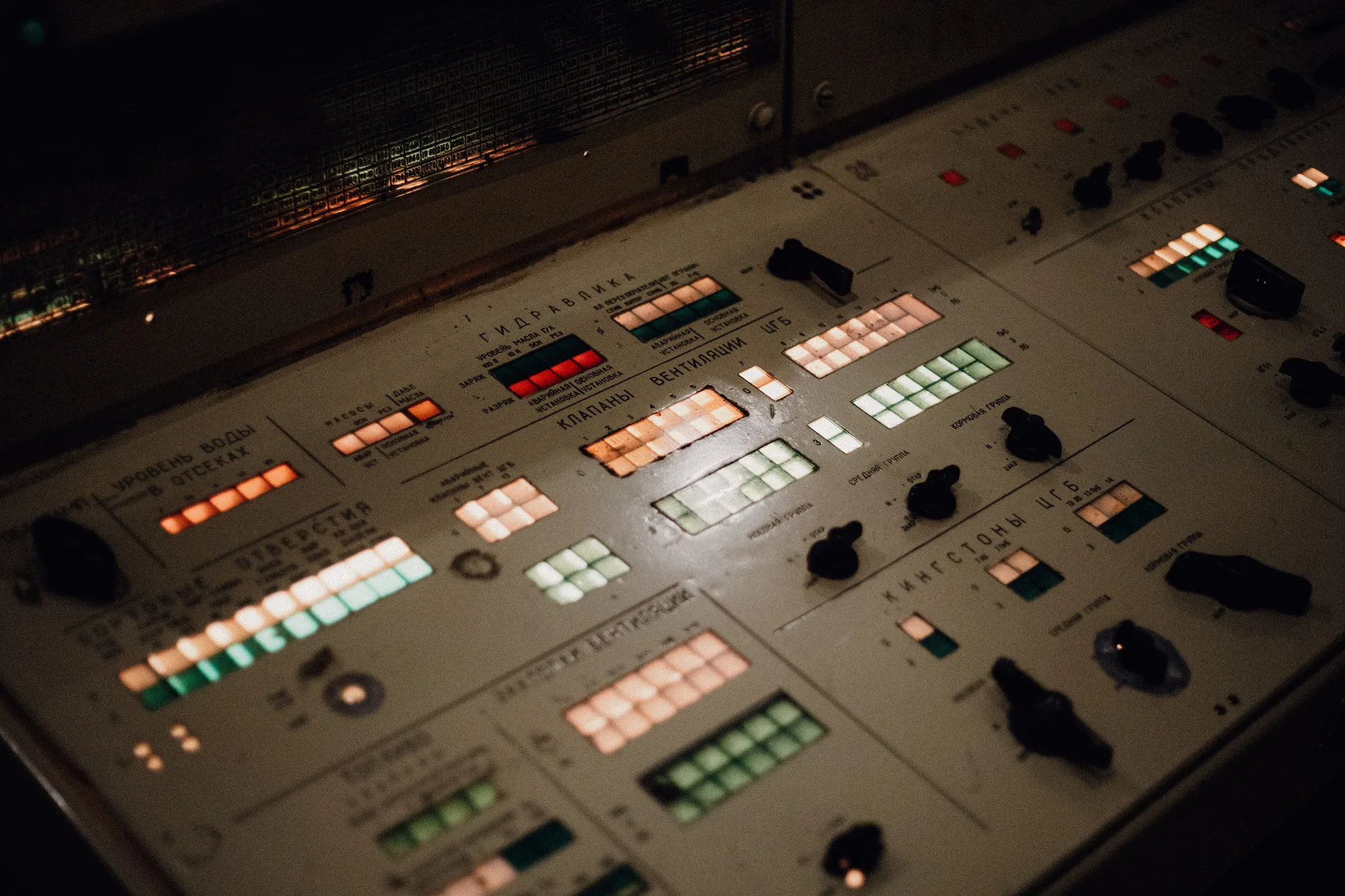 Close-up of an illuminated control panel with buttons and switches
