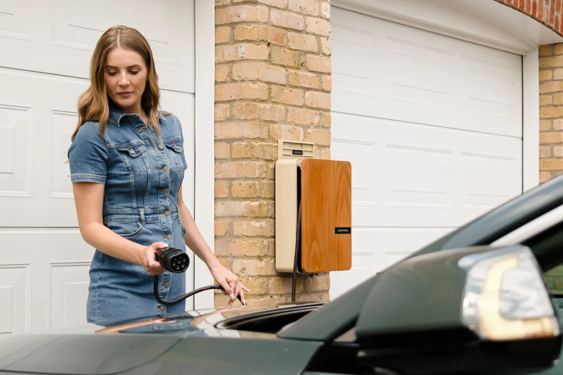 A home electric vehicle charger mounted on a garage wall