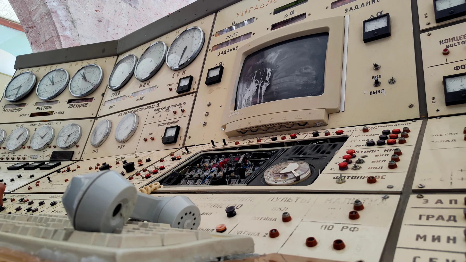 Retro control panel with dials, buttons, and vintage electronics