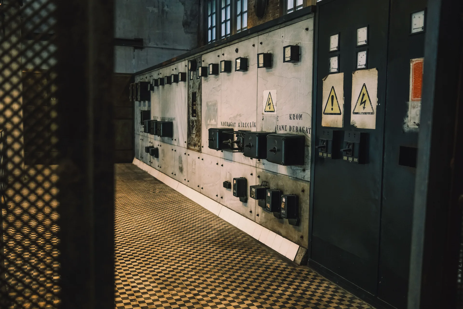 A vintage industrial control panel in a dim room