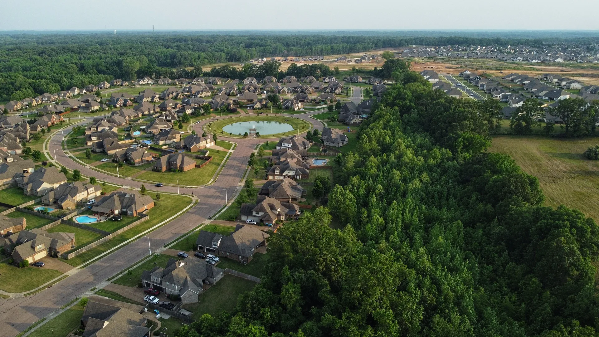 Aerial view of a suburban neighborhood with houses and trees
