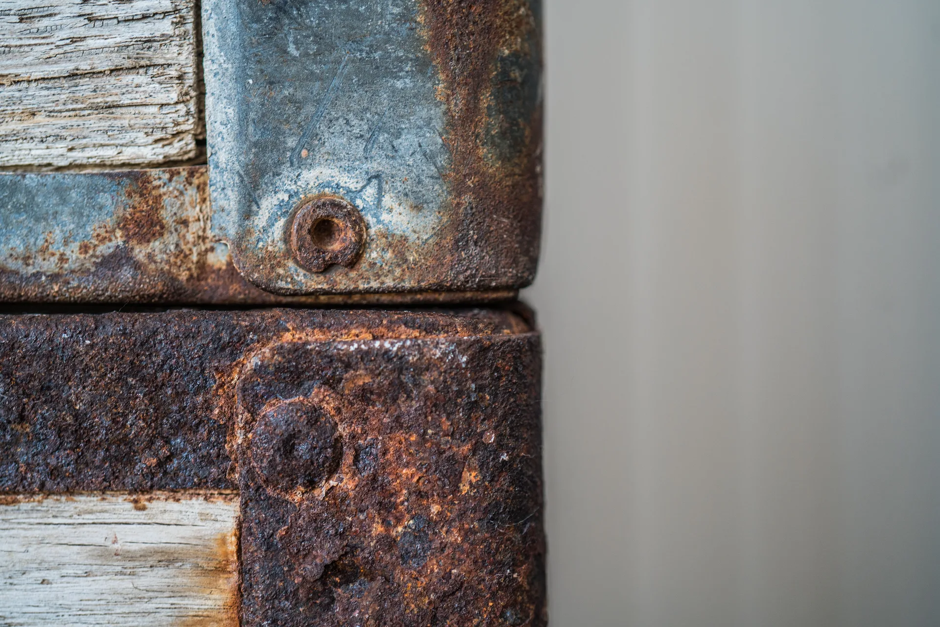 Close-up of rust and texture on an old metal corner piece